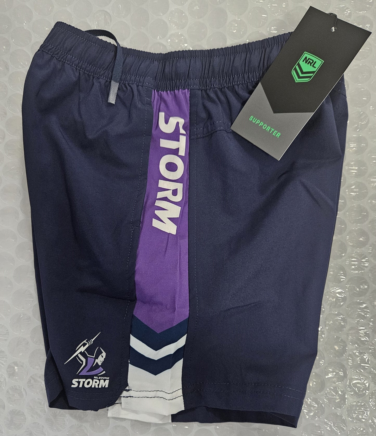 NRL TECH SHORTS STORM -SIZE 6 KIDS